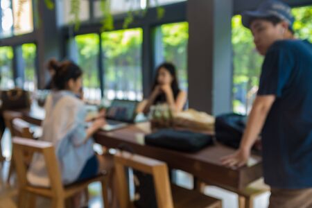 Blurred group of customer talking in coffee shop business discusion