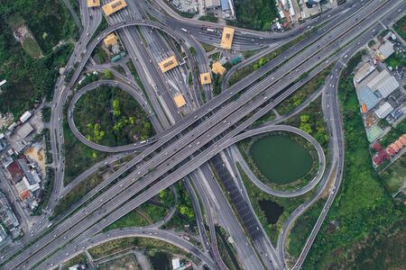 Aerial view intersection coty cross road with vehicleの写真素材