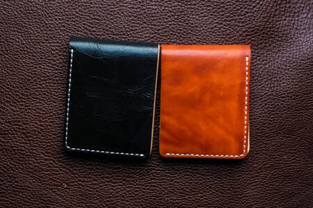 Genuine leather wallet handmade on leather background craftsmanship object