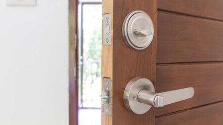 Modern knob dead lock on teak wooden door, Interior objectの写真素材