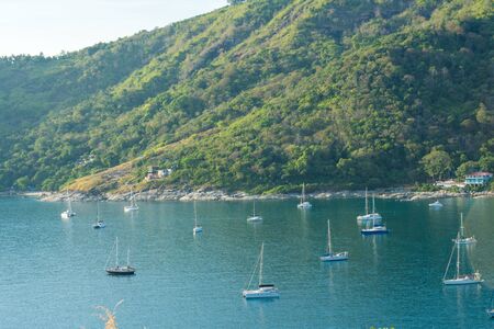 Sea bech bay sun light evening with yacht Phuket Thailandの写真素材