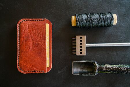 Genuine leather money card purse craftmanship working with handmade toolの写真素材