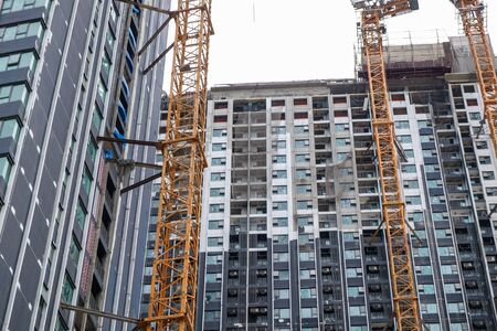 Construction site modern high rise condominium building in growth business city