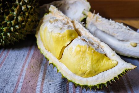 Yellow durian tropical fruit on wood background, Thailand fruitの写真素材