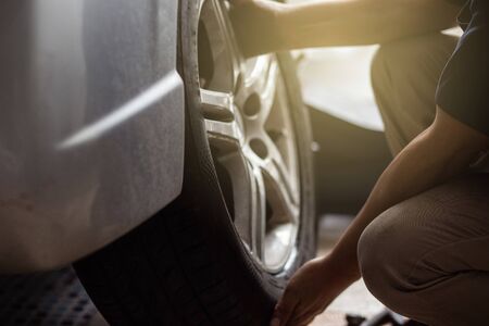 Mechanical car garage changing and replace car tire with mechanical stable engineの写真素材