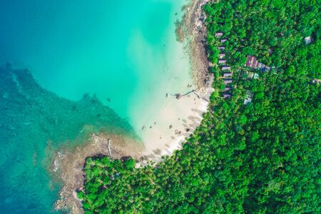 Turquoise sea water with beach on island green tropical forest aerial viewの写真素材