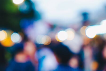 Abstract blurred people walking in outdoor market sunny dayの写真素材