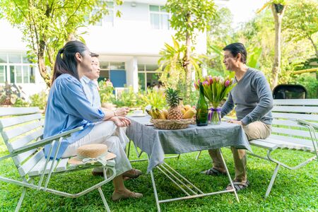 Celebration of senior small party food and drink in city park, Asian agedの写真素材