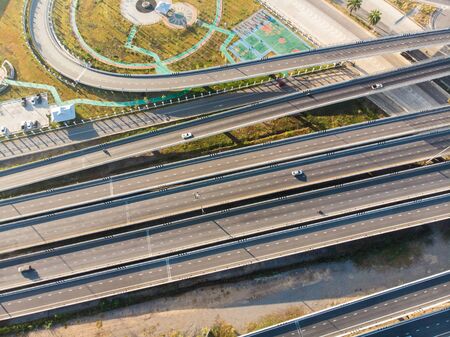 City transport junction road morning sun shadow with vehicle movement aerial view