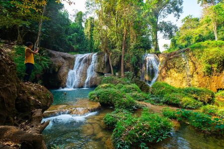 Beautiful waterfall with emerald pool water slope in tropical  rainforest Thansawan waterfall Phayao, Thailandの写真素材