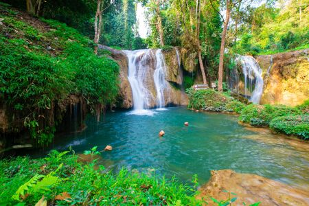 Beautiful waterfall with emerald pool water slope in tropical  rainforest Thansawan waterfall Phayao, Thailandの写真素材