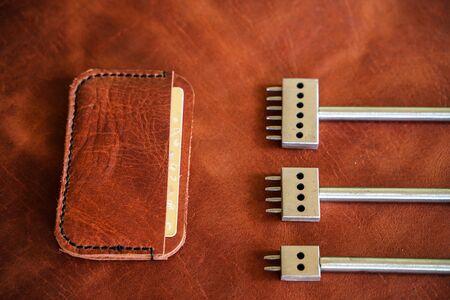 Leather card wallet handmade with thread and leather tool object craftsmanship working