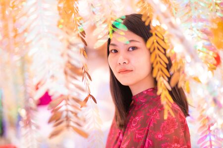 Night portrait of christmas fashion women enjoying in christmas tree new year festivalの写真素材