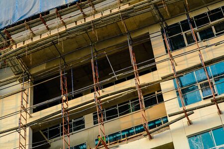 Construction site of glass window modern office building high rise buildingの写真素材