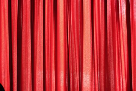 Luxury red closed curtain with light spots in a theater, Red curtainの写真素材