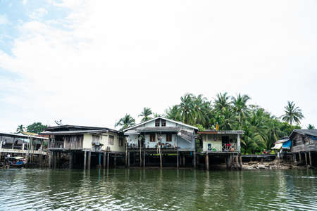 Fishery village wooden house with boat in Krabi Thailandのeditorial素材