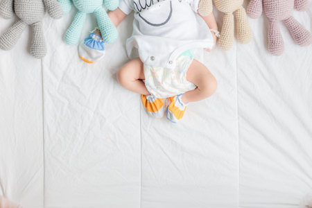 Adorable baby boy sleeping with many cute doll top viewの写真素材