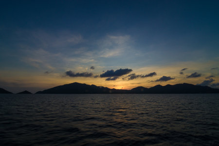 Silhouette sea sunrise colorful sky with cloud nature seascapeの写真素材