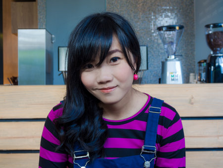 Beautiful asian women sitting in cafe restaurant with food and drinkの写真素材