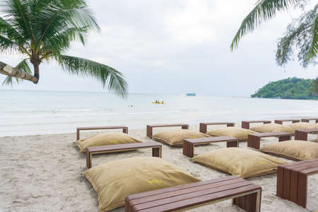 Pillow beach chair on white sand beach summer travel