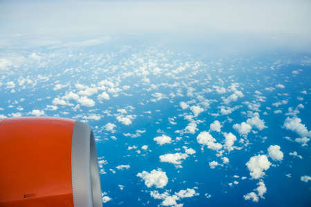 Aerial blue sky cloud view from airplane window nature transportの写真素材