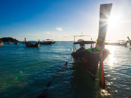 Boat on sea beach colorful sky sunset nature vacation landscape Lipe Thailandの写真素材