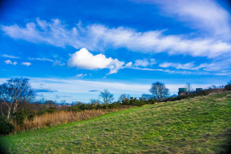 Blackford hill view point green meadow grass blue sky with cloud, Edinburgh Scotlandの写真素材