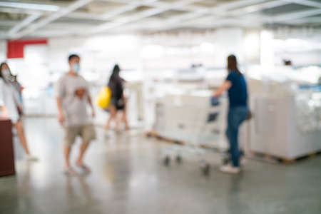 Abstract blurred people shopping in mall store business backgroundの写真素材