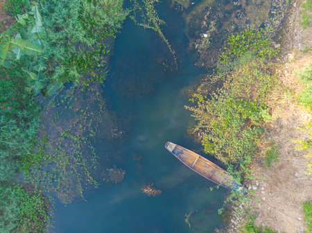 Paddle old boat on river with morning fog sunrise aerial viewの写真素材
