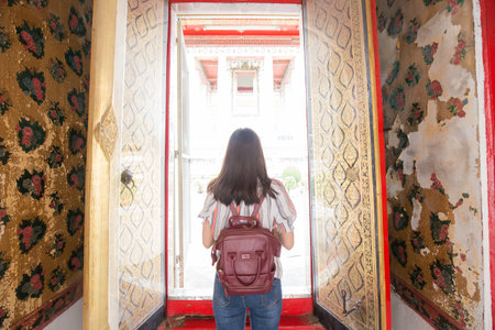 Beautiful asian women walking travel in buddhist temple of Bangkok Thailandの写真素材