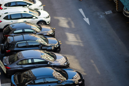 Top view of car parking area on asphalt road in modern condominium buildingの写真素材