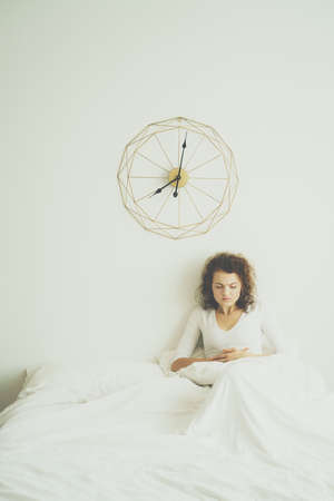 Young woman suffering from abdominal pain stomach aches while wake up in morning