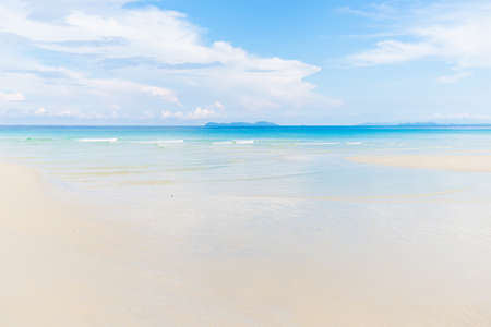 White sand empty sea beach sunny day blue sky summer travel landscapeの写真素材