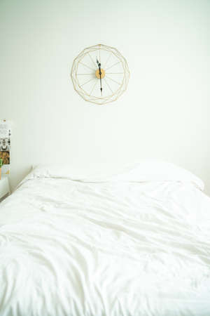 Cozy white bedd room minimal interior decoration with morning lightの写真素材