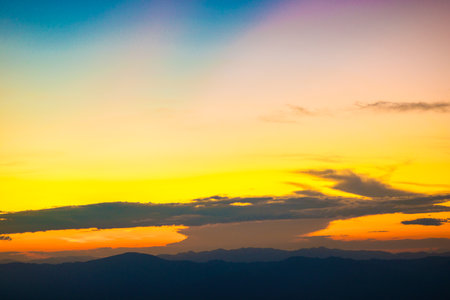 Sunset sky with cloud on top of mountain colorful nature landscapeの写真素材