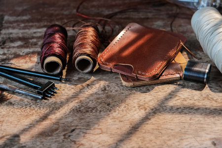 Leather wallet card making with leather tool craftmanship object on wood