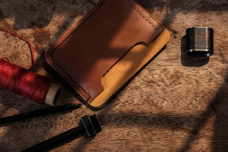 Leather wallet card making with leather tool craftmanship object on wood