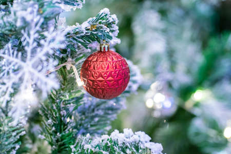 Red christmas ball and gift decoration on christmas tree night scene merry christmasの写真素材
