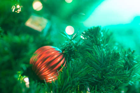 Red christmas ball and gift decoration on christmas tree night scene merry christmas
