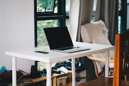 Laptop on white table black sceen in cozy house work from home concept