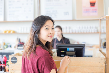 Beautiful asian women order coffee drink on couter bar business womenの写真素材