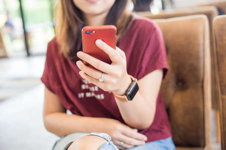 Business women hand use smartphone while sitting in cafe smart womenの写真素材