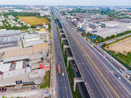 Aerial view intersection transport road with car movement city building transport backgroundの写真素材