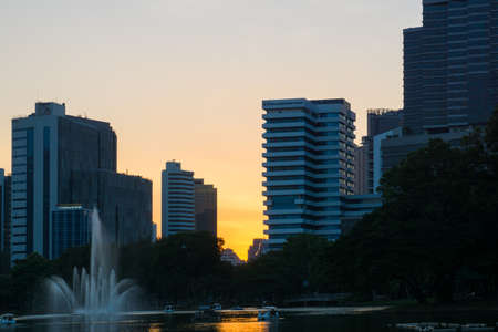 Silhouette office building sunset light in public park Bangkok Thailandのeditorial素材