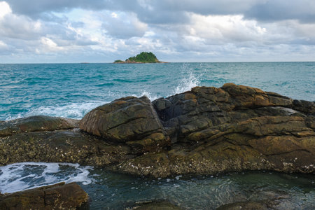 Sea coast rocky beach sunset light with blue sky cloud sea scape