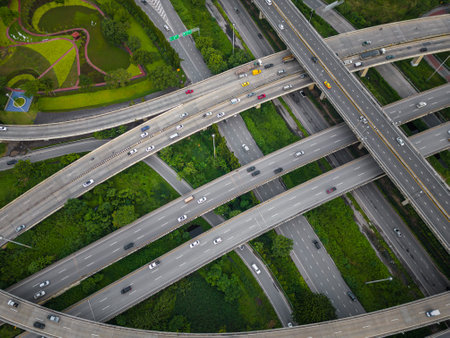 Aerial view city transport junction cross road with green public parkの写真素材