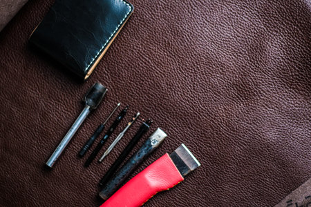 Genuine leather bifold wallet working with tool on leather craftmanship objectの写真素材