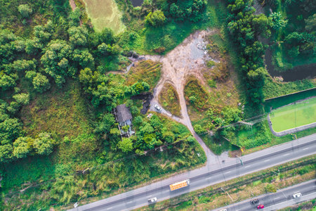 Bird eye view of transport car on the road with tree rural road of Thailandの写真素材