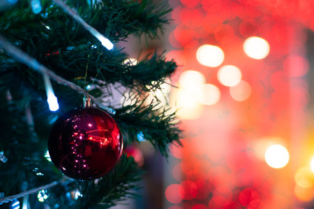 Christmas ball decorate on luxury pine tree branch night light bokeh blurred background scene happy new yearの写真素材
