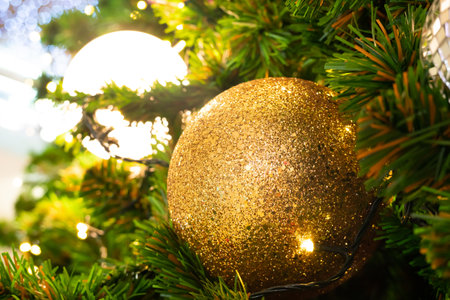 Christmas ball decorate on luxury pine tree branch night light bokeh blurred background scene happy new yearの写真素材